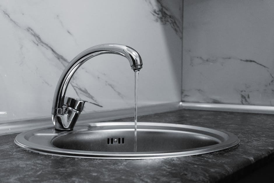 Modern kitchen sink and faucet in a newly remodeled kitchen